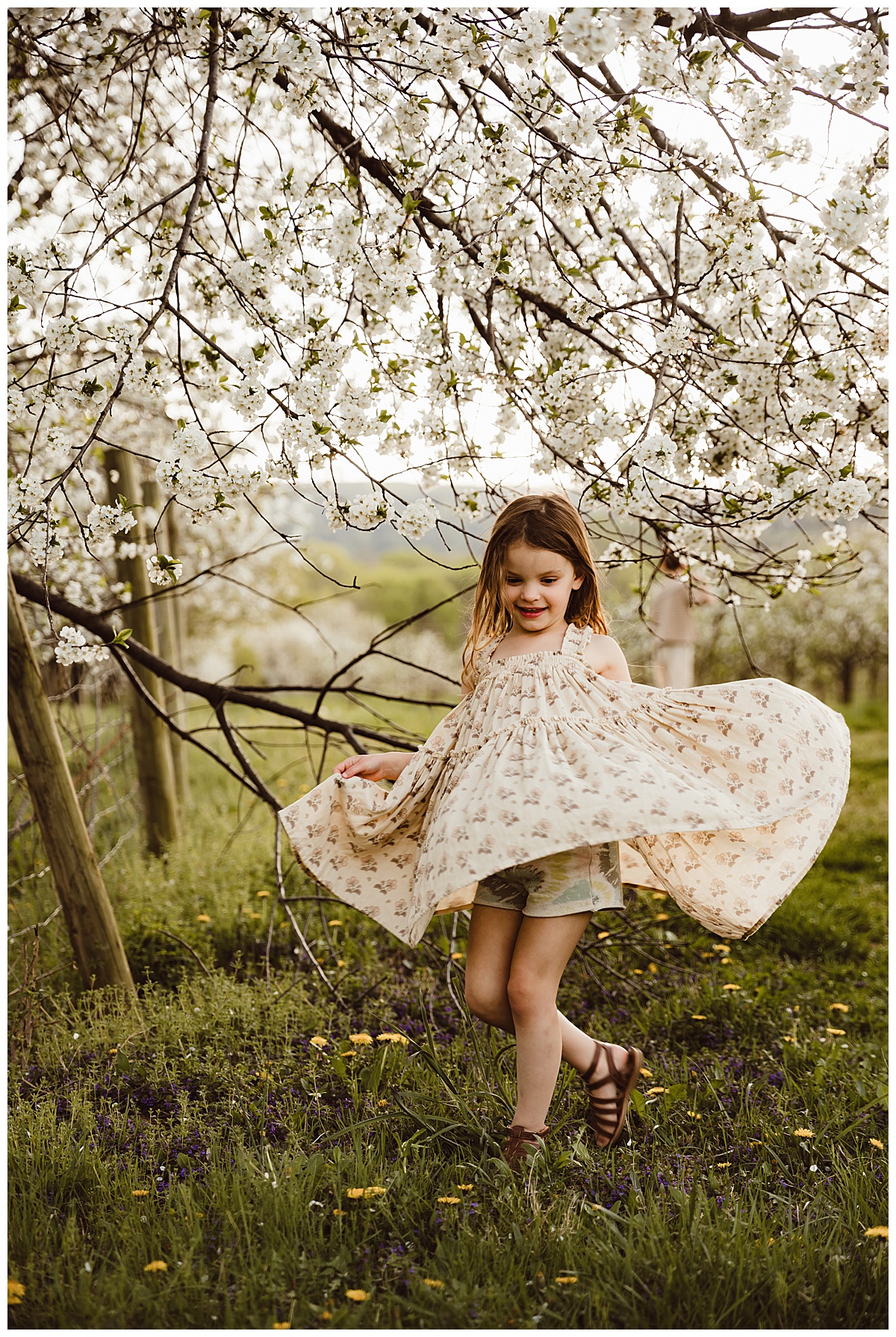 Little girl dances in her dress for Norma Fayak Photography