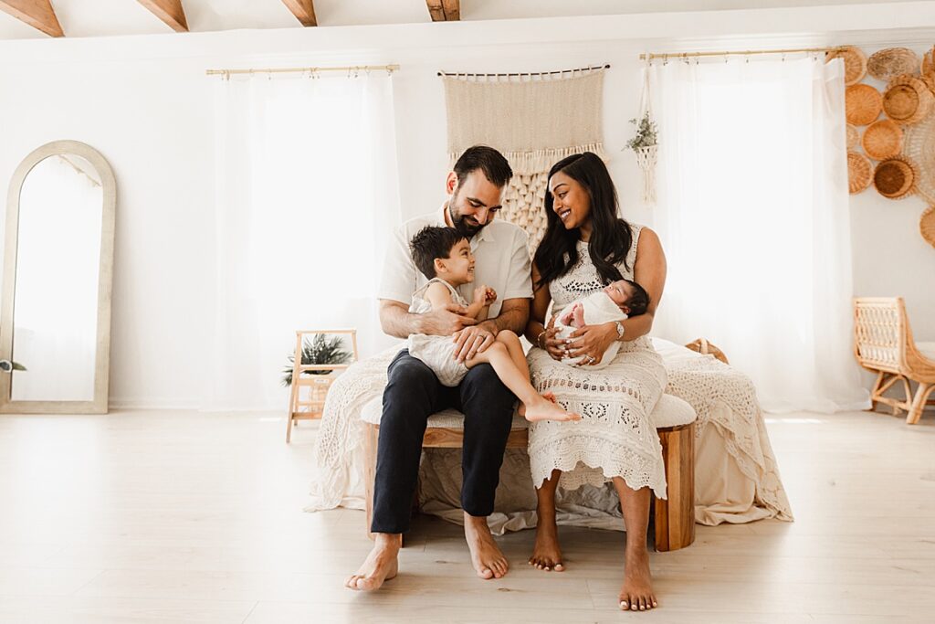 Dad and mom love on sons for sVirginia Newborn Photographer