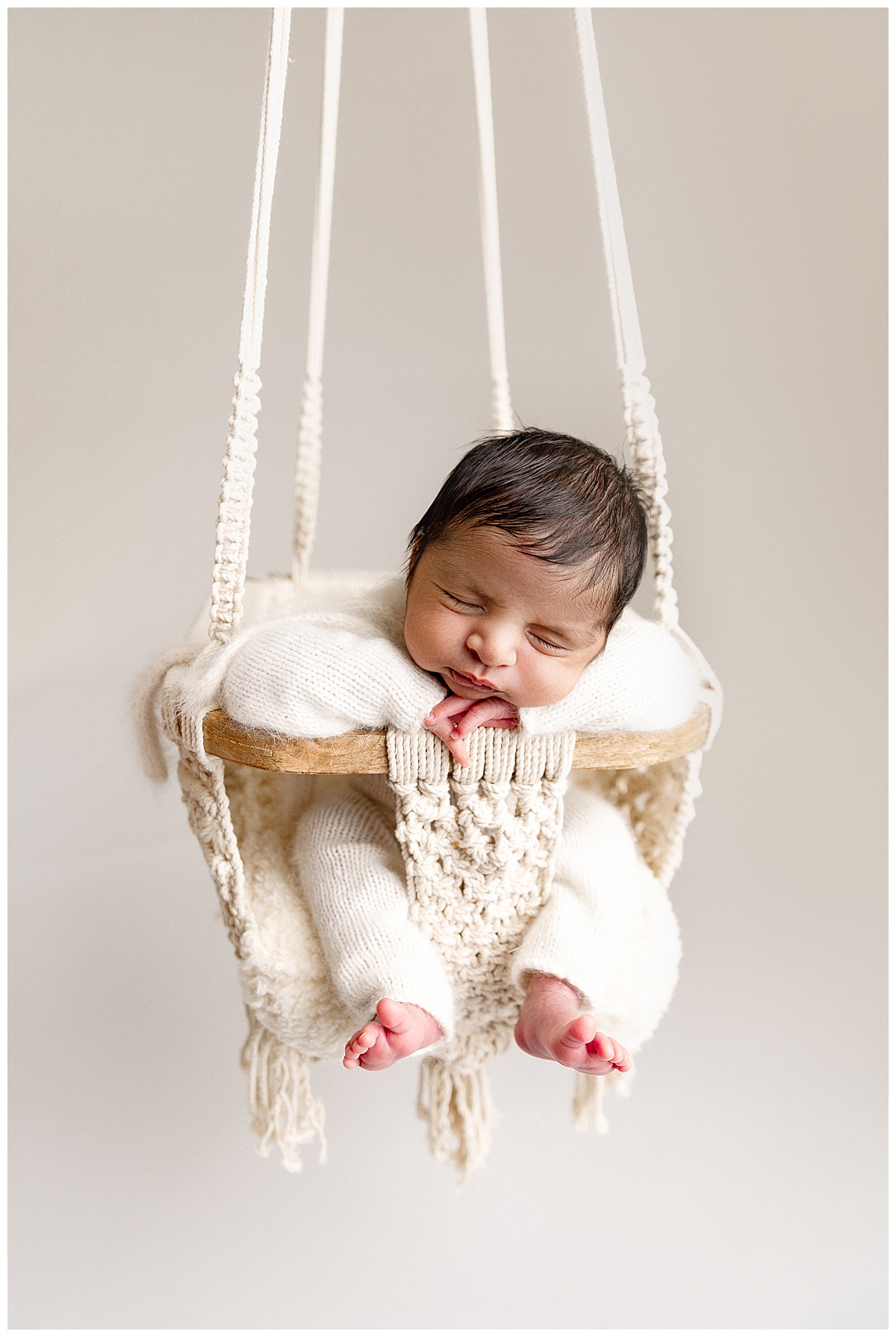 Young baby in swing for Norma Fayak Photography
