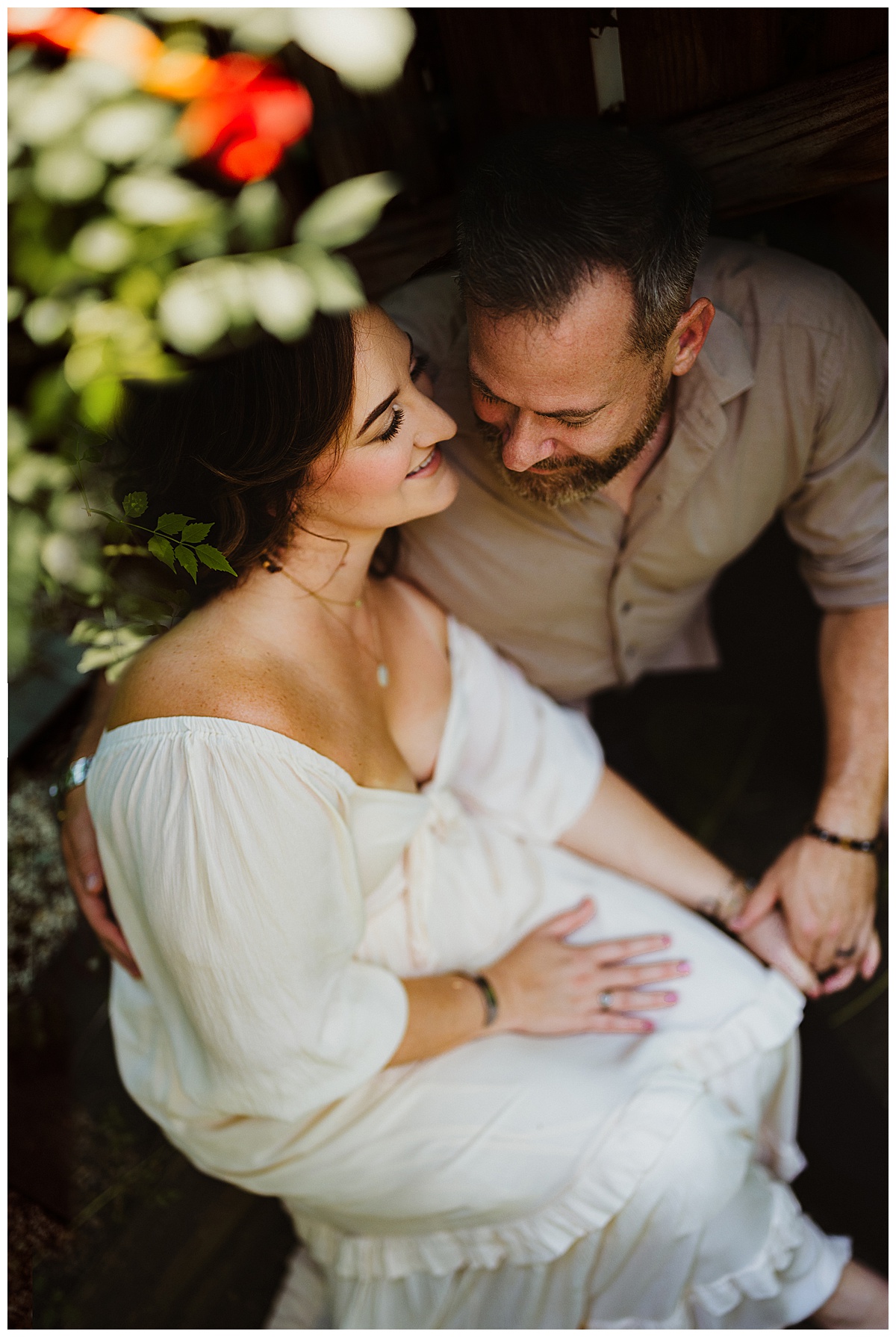 Mom and dad smile together for their Virginia Maternity Photographer