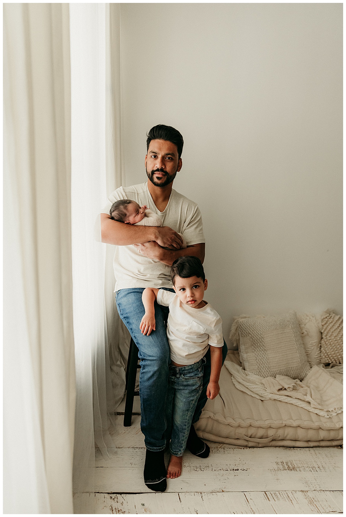 Dad stand with his kids after a Successful Newborn Session With Your Toddler