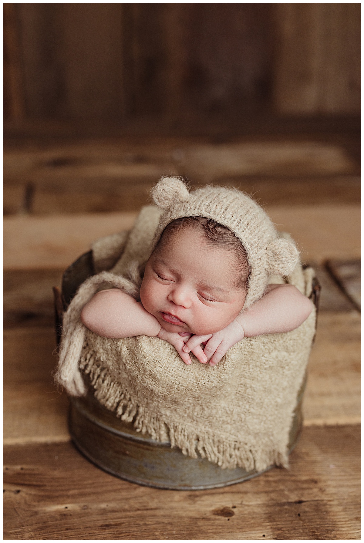 Baby sleeps in little basket for Norma Fayak Photography