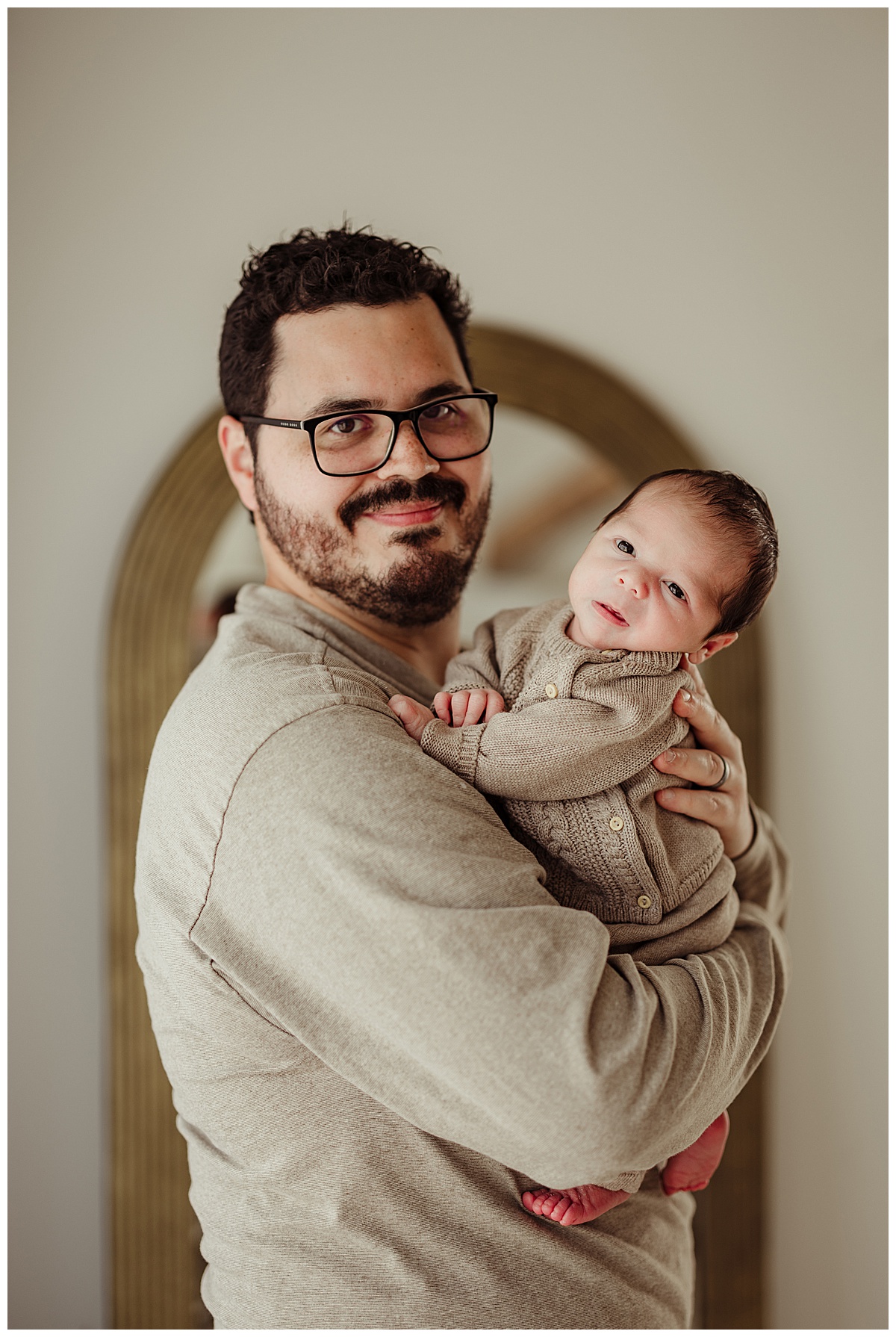 Dad holds baby wearing one of my Fine Art Newborn Outfits
