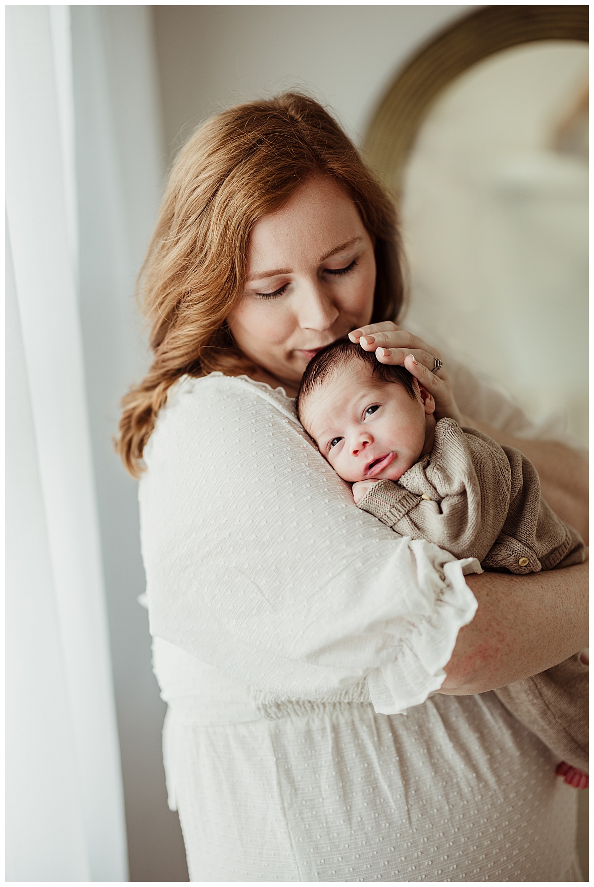 Mom and baby cuddle together for Norma Fayak Photography