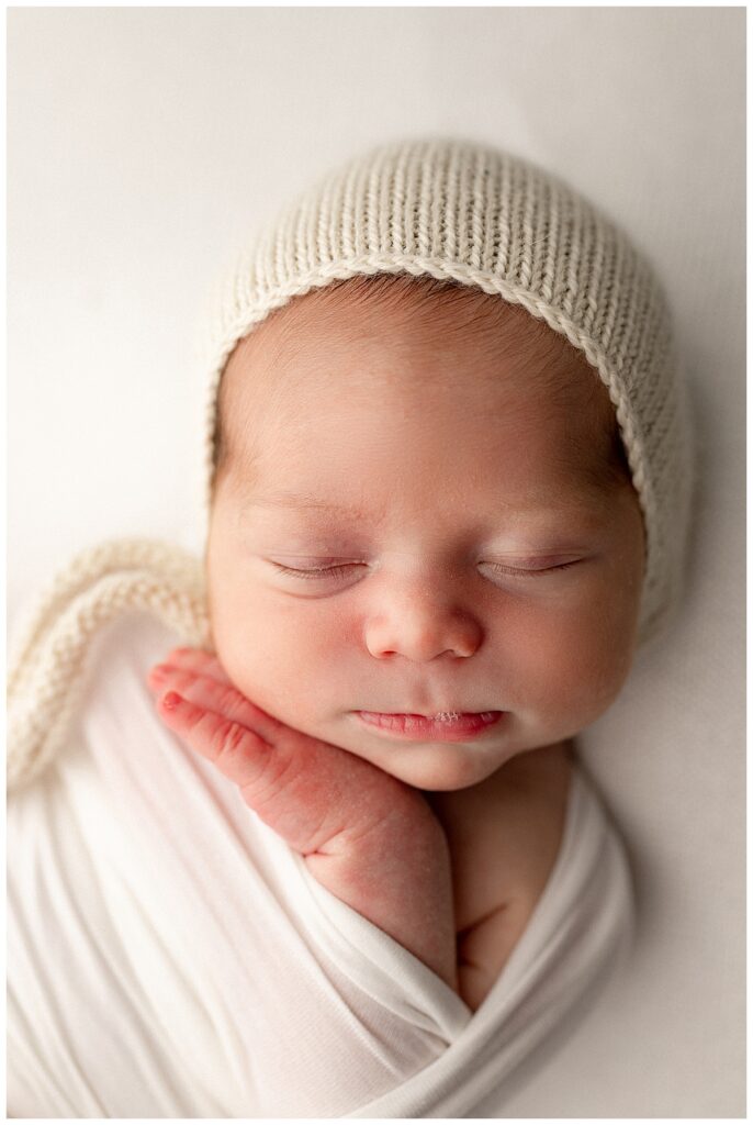 Baby closes eyes for Norma Fayak Photography