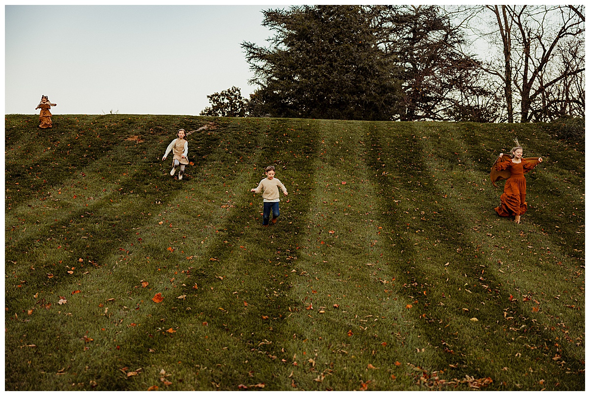 Kids run down a hill for Norma Fayak Photography