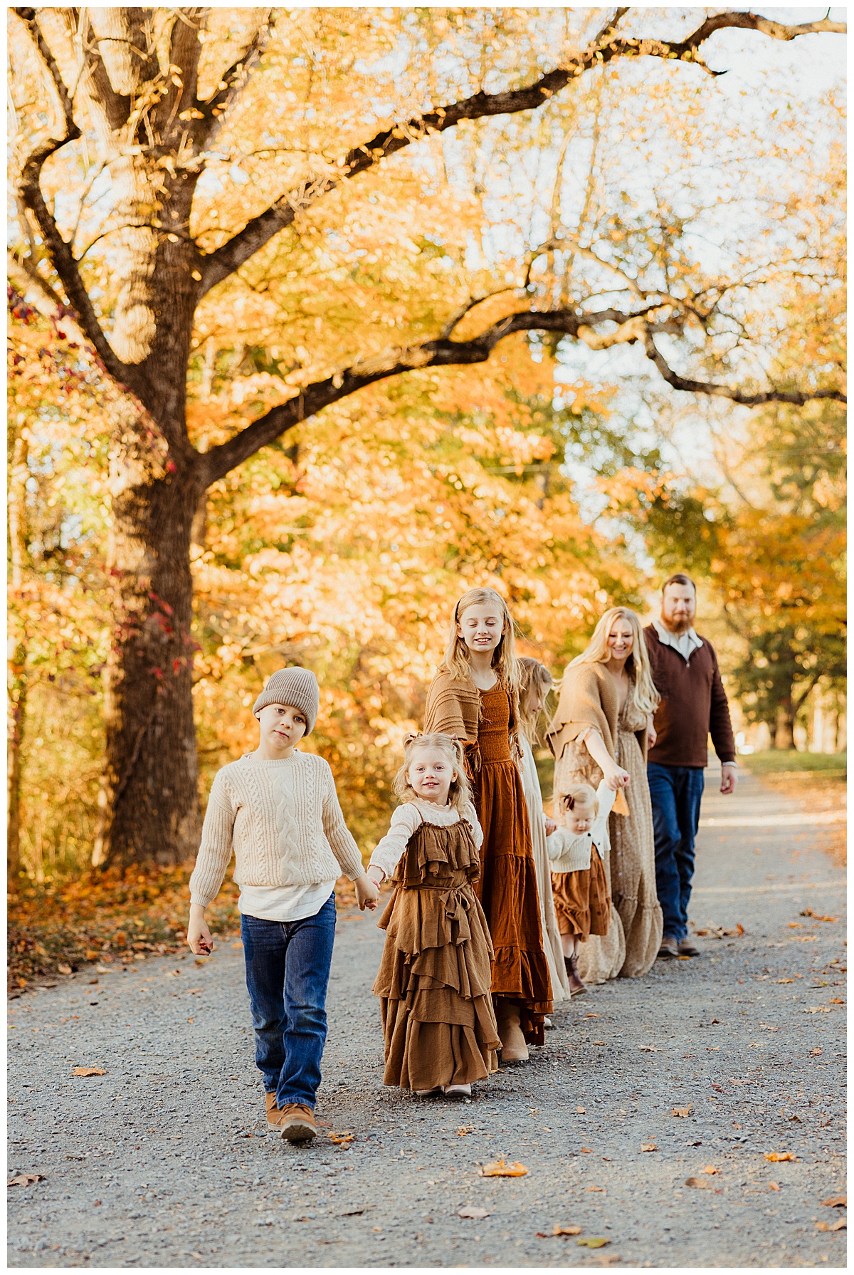 Kids walk with their parents wearing Neutral Color Palette For Family Photos
