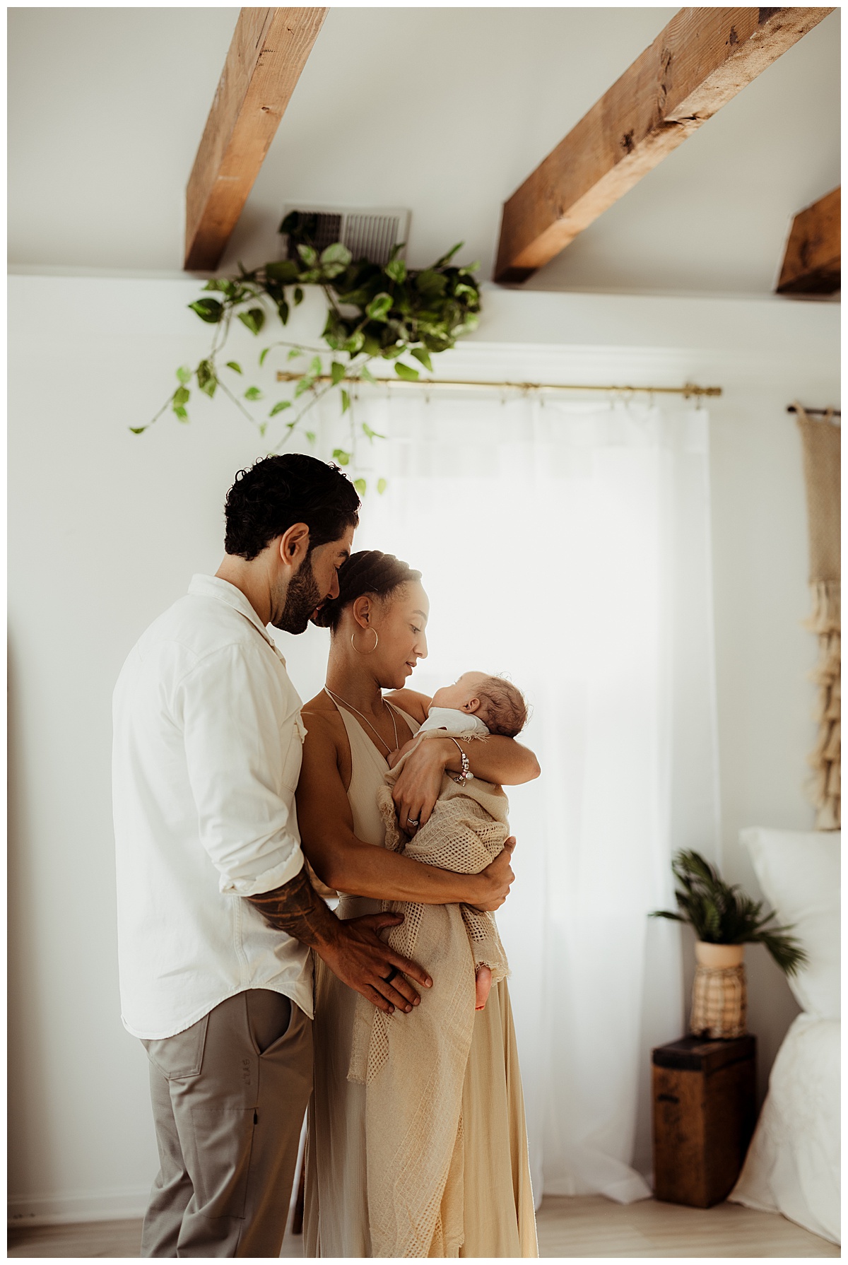 Parents smile at their little one for Virginia Newborn Photographer