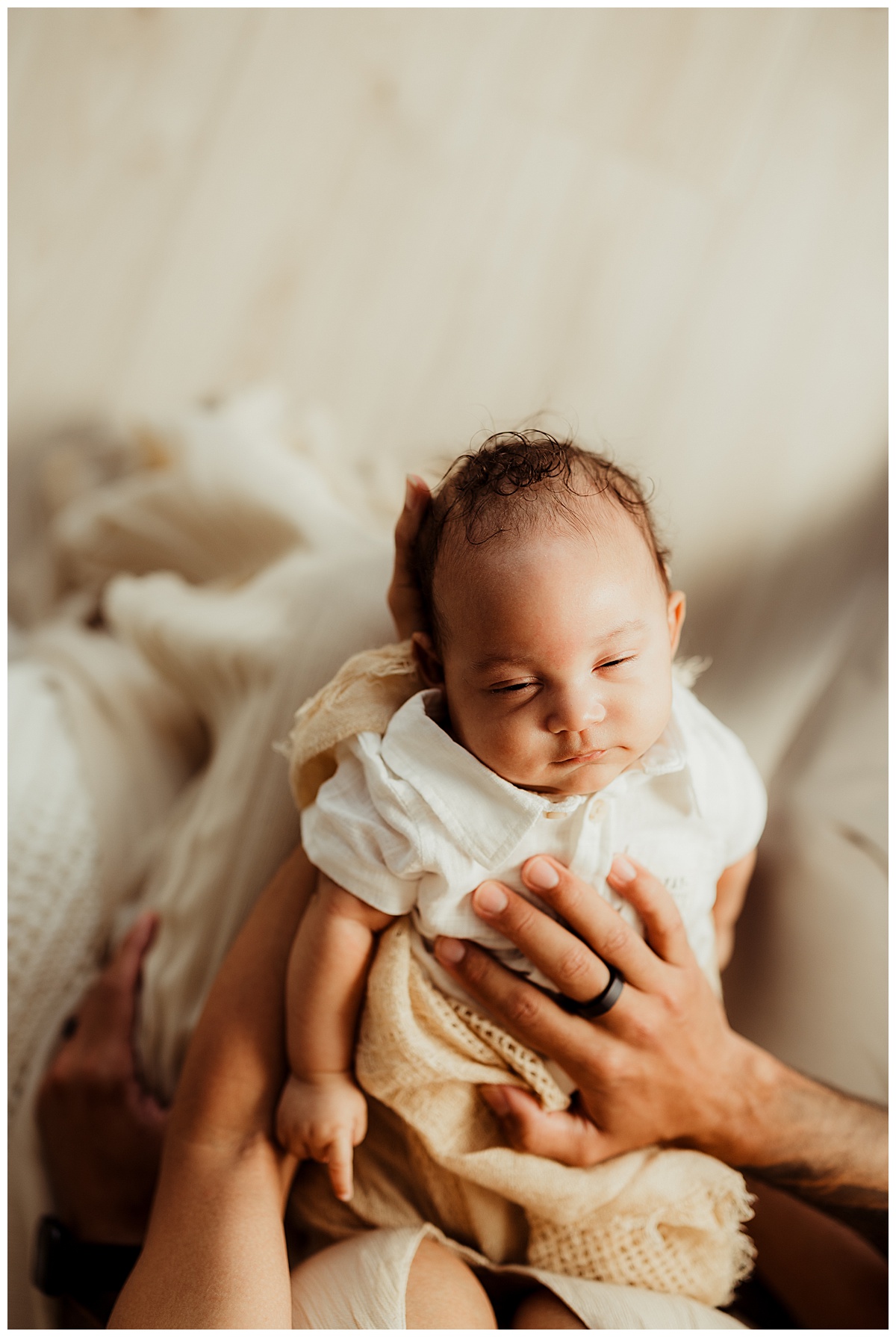 Young baby smiles during their Virginia Newborn Photographer