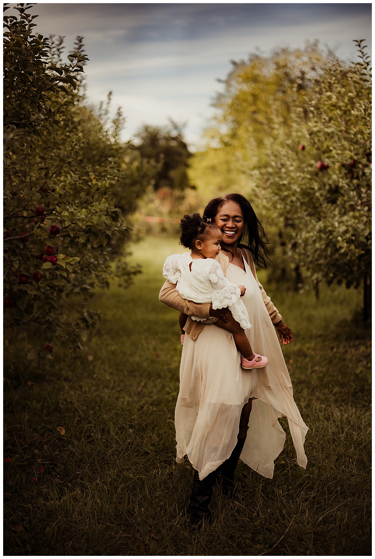 Mother and daughter smile together for Outdoor Adventure Golden Hour Session at Great Country Farms