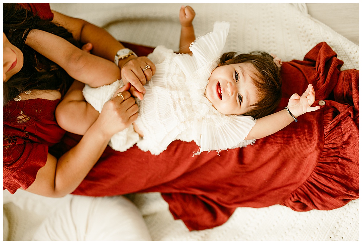 Daughter lays on mother's lap for Virginia Family Photographer