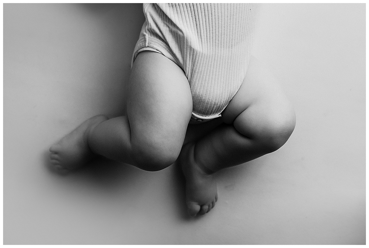 Tiny baby legs stretching out by Norma Fayak Photography