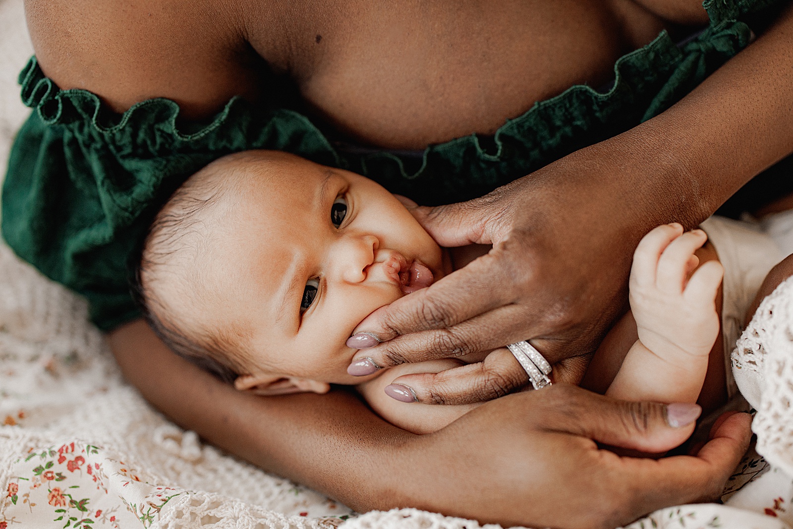 Mom cuddles baby for Lifestyle Newborn Session