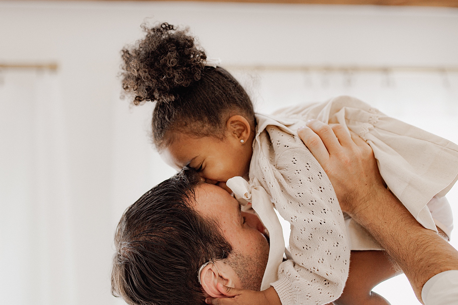Dad and daughter share a cute moment together for Virginia Newborn Photographer