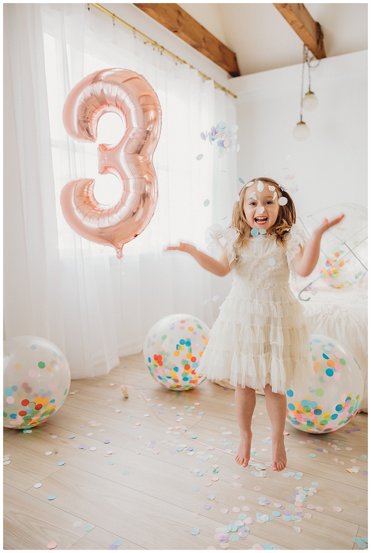 Little girl dances under confetti for Norma Fayak Photography
