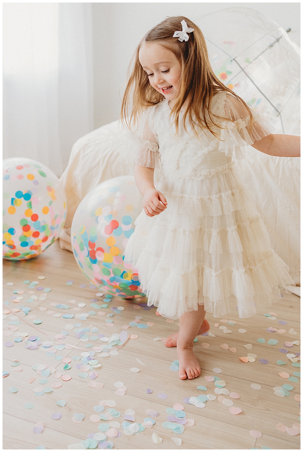 Little girl dances in confetti for Virginia Baby Photographer