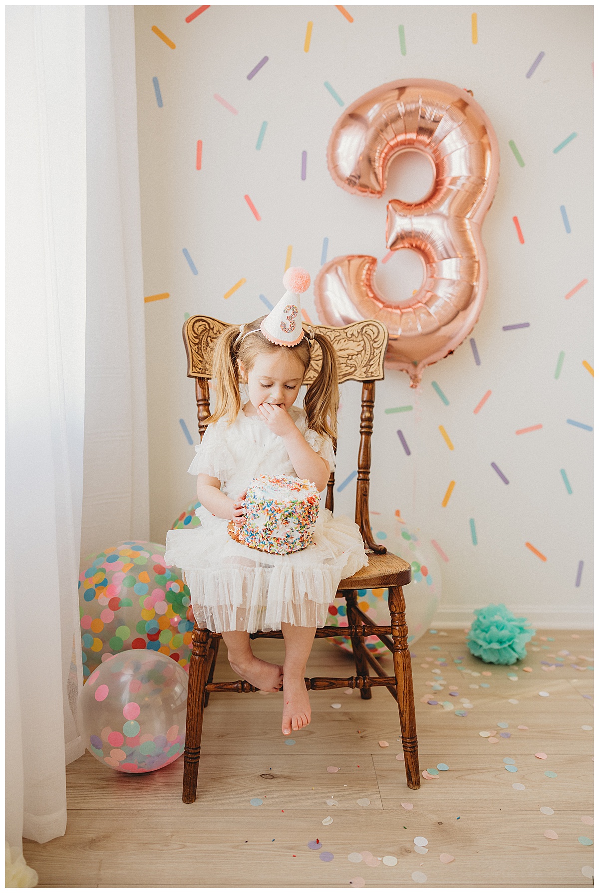Young girl enjoys birthday cake during her 3-Year-Old Milestone Session