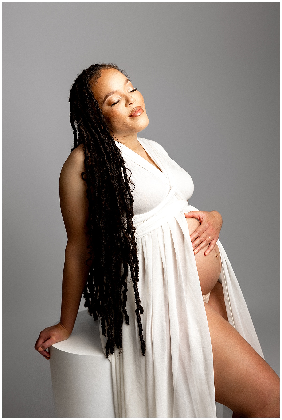 Mom holds pregnant belly for Virginia Maternity Photographer