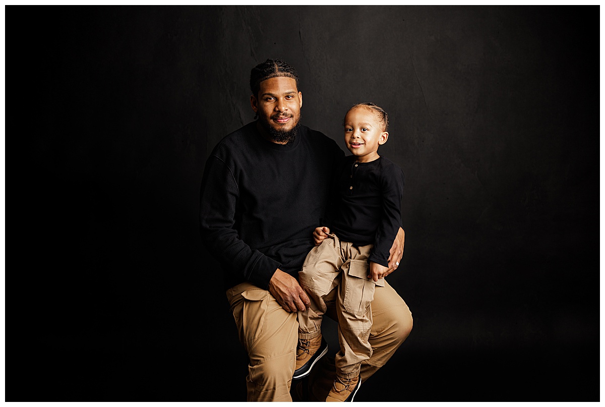 Father and child sit together for Norma Fayak photography